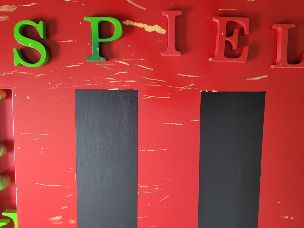 Ein Bild Ausschnitt mit den Buchstaben SPIEL